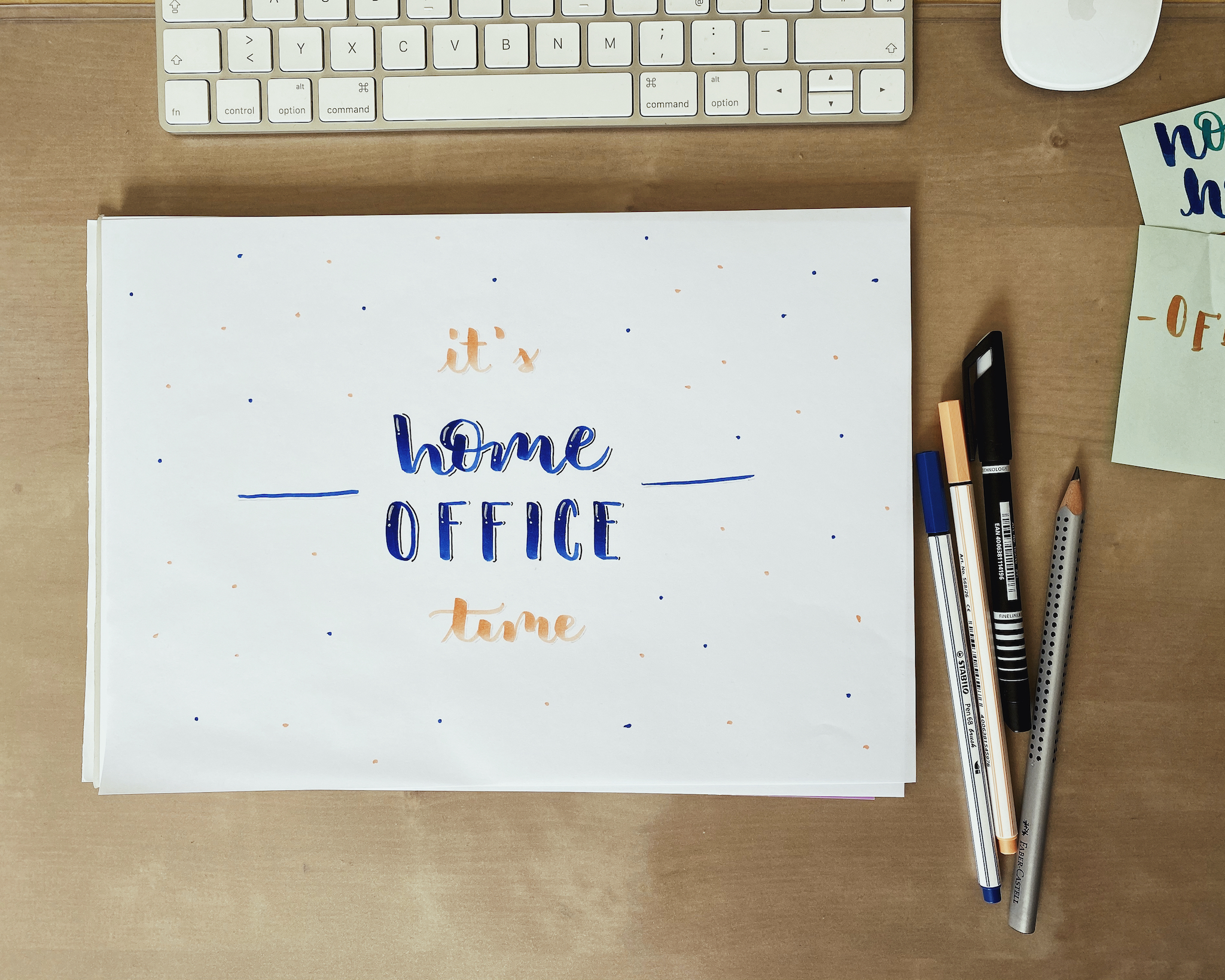 Lettering next to a keyboard which says it's home office time